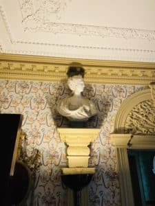 A marble bust of a woman on a column.