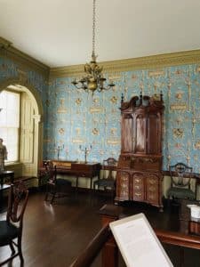 A reading room with a large mahogany bookcase.