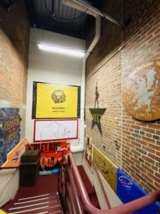 Murals and cast signatures on a wall inside PPAC.