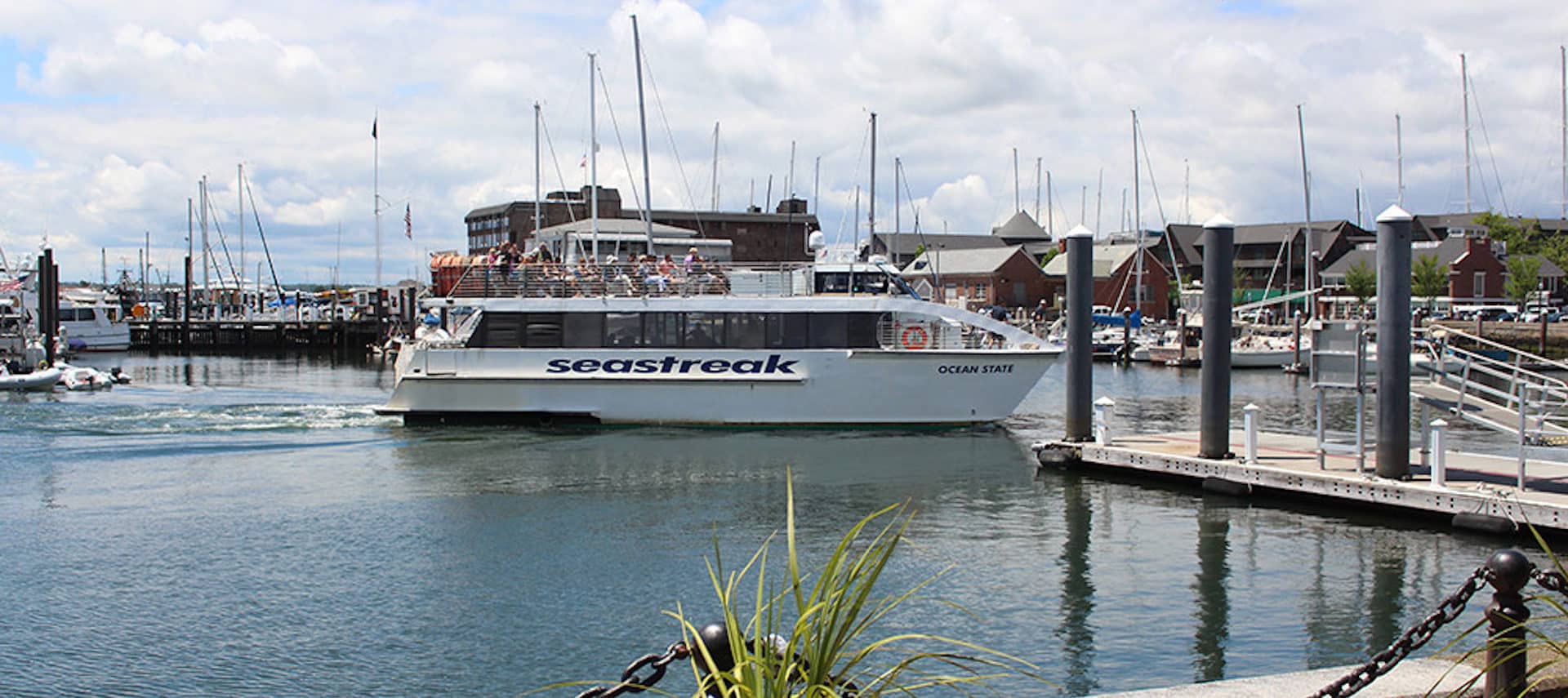 The Sea Streak Ferry docking in sunny Newport, Rhode Island.