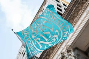 Teal and white flag with the lettering, RISD.