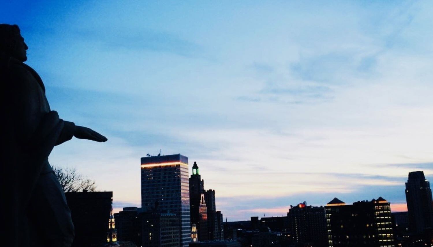 Skyline of Providence Rhode Island at dusk with tall buildings. 